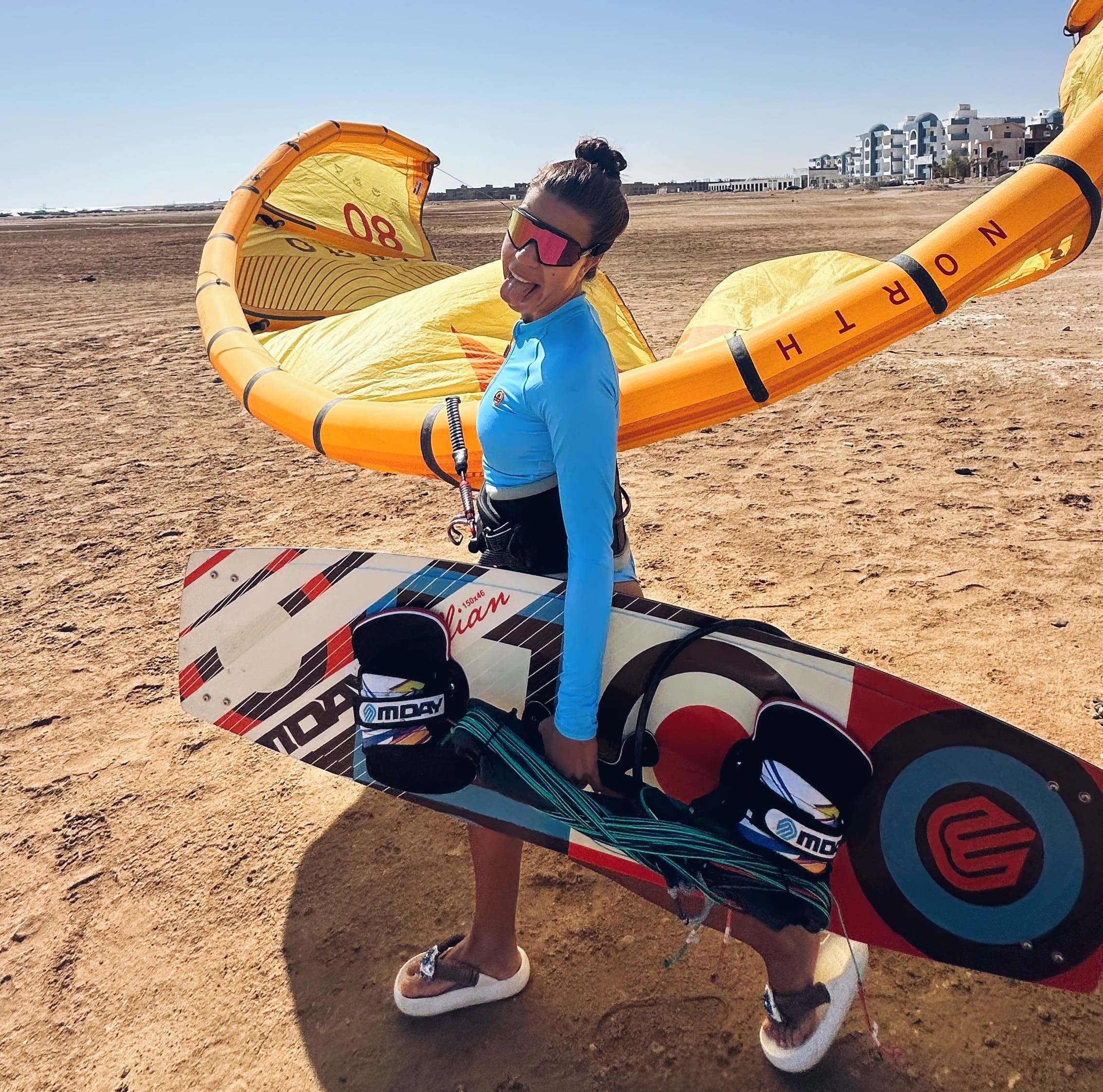 The girl is walking with a kite